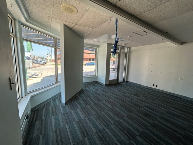 Front room facing window and door